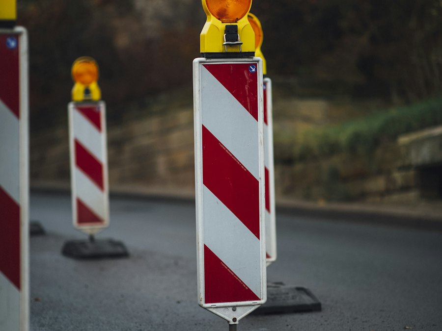 Red and white barricade panels closing a section of roadway