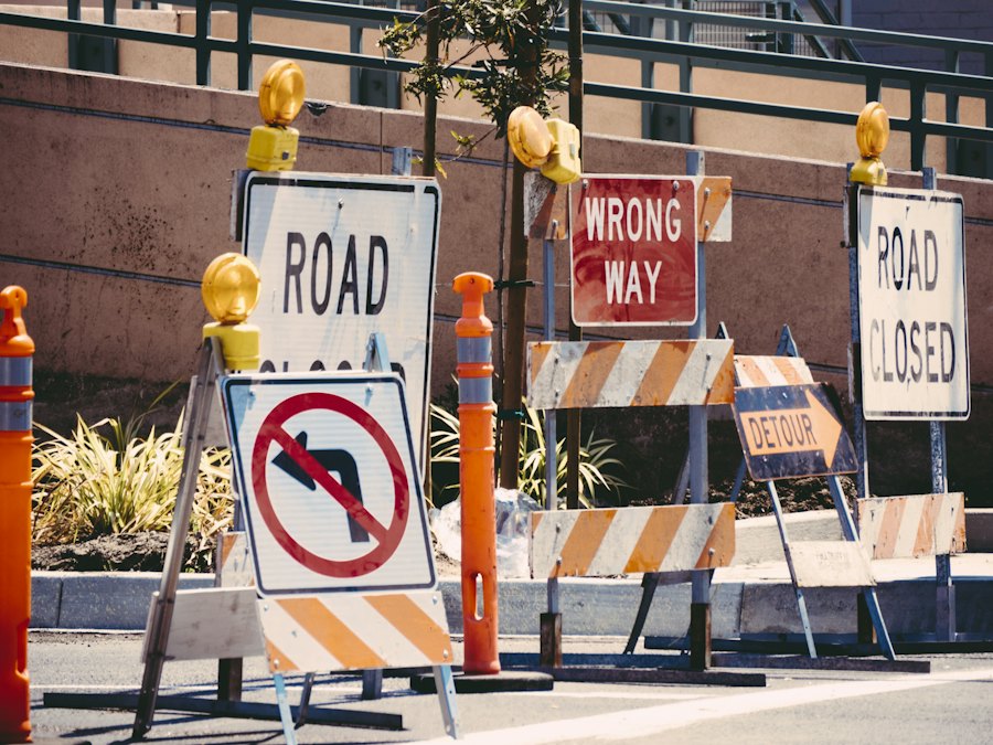 ROAD CLOSED and WRONG WAY barricades signing a closed roadway