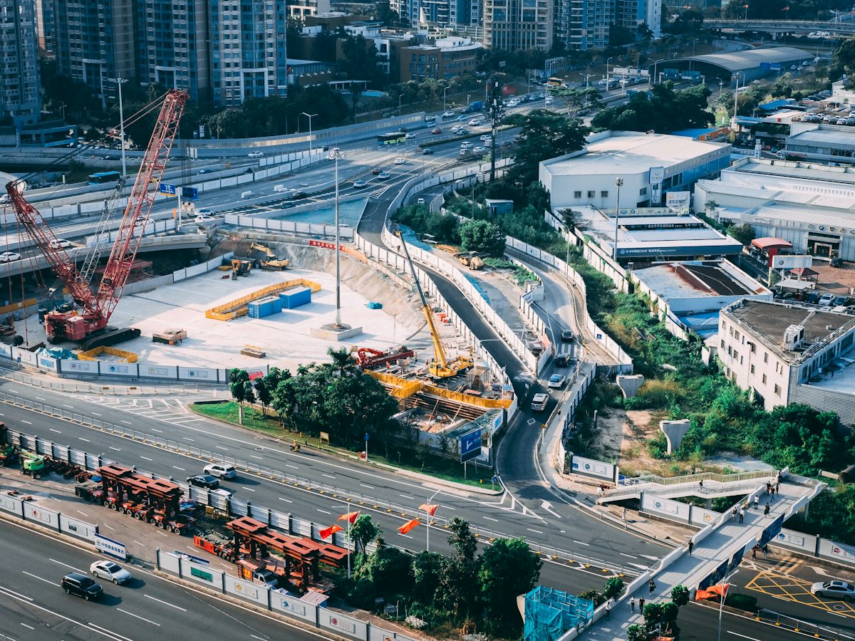 Aerial view of a multi-level highway interchange with construction underway