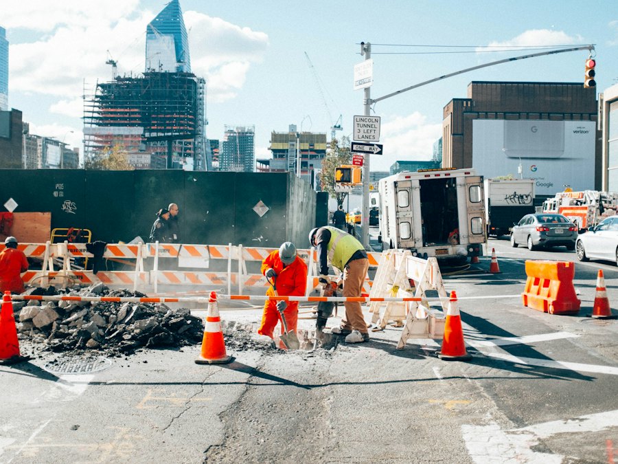 Cones and channelizing devices narrowing traffic to a single lane past a city work area